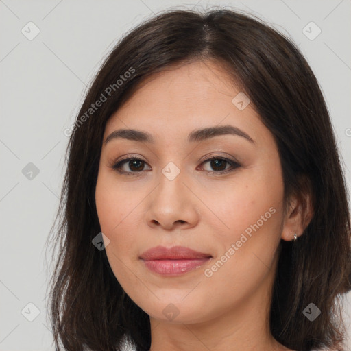 Joyful asian young-adult female with long  brown hair and brown eyes