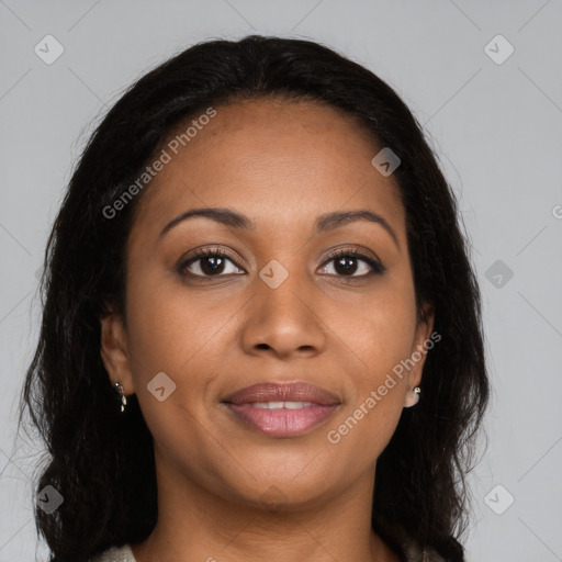 Joyful black young-adult female with long  brown hair and brown eyes