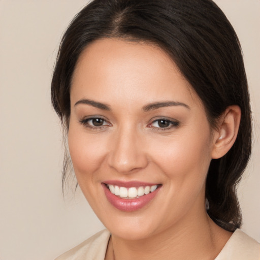 Joyful white young-adult female with medium  brown hair and brown eyes