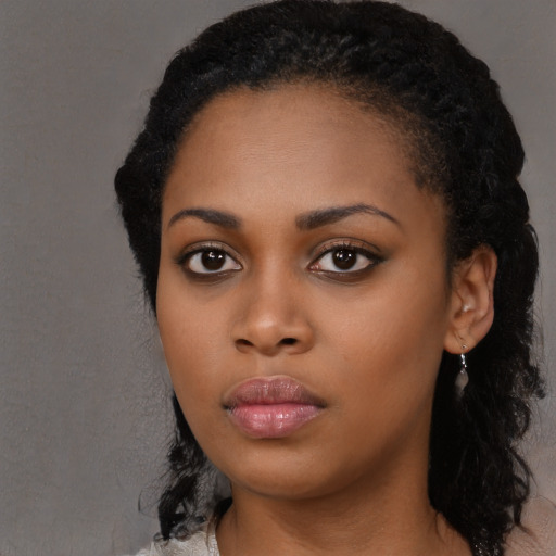 Neutral black young-adult female with long  black hair and brown eyes