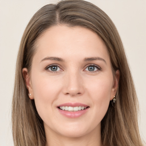 Joyful white young-adult female with long  brown hair and grey eyes