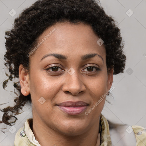 Joyful black adult female with medium  brown hair and brown eyes