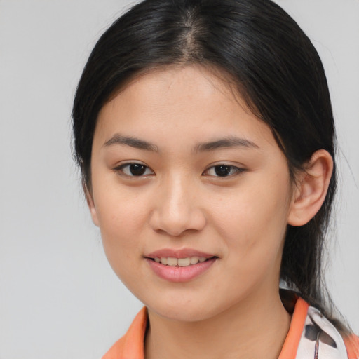 Joyful asian young-adult female with medium  brown hair and brown eyes