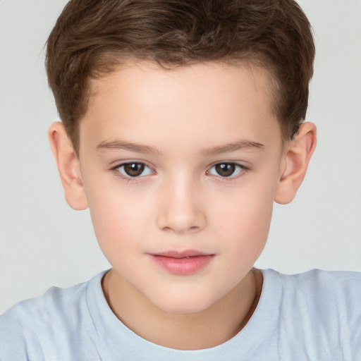 Joyful white child male with short  brown hair and brown eyes