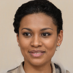 Joyful latino young-adult female with short  black hair and brown eyes