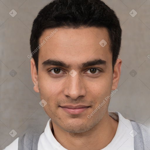 Joyful white young-adult male with short  black hair and brown eyes