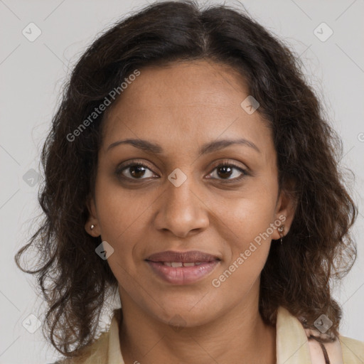 Joyful black adult female with medium  brown hair and brown eyes