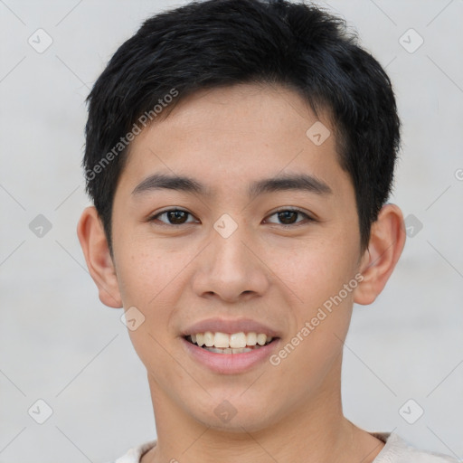 Joyful white young-adult male with short  black hair and brown eyes