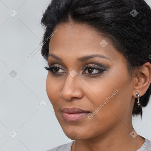 Joyful black young-adult female with medium  black hair and brown eyes