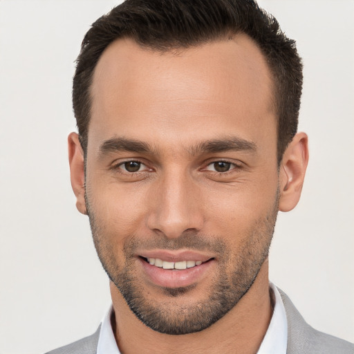 Joyful white young-adult male with short  brown hair and brown eyes