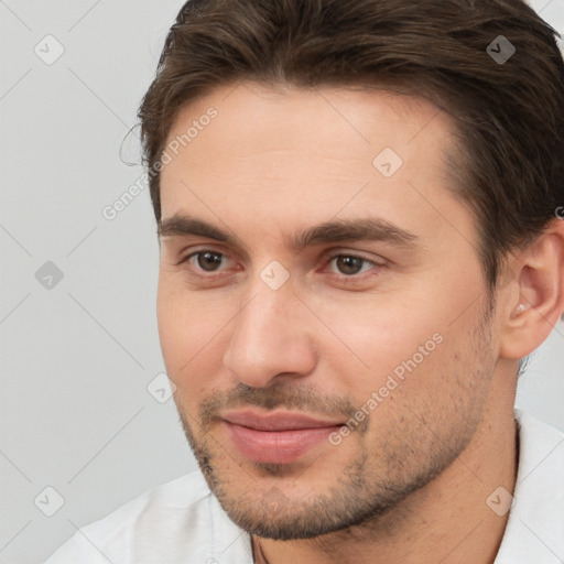 Joyful white young-adult male with short  brown hair and brown eyes