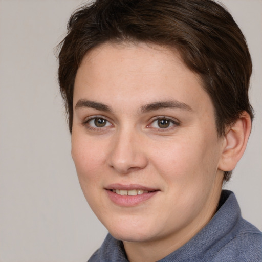 Joyful white young-adult female with short  brown hair and brown eyes