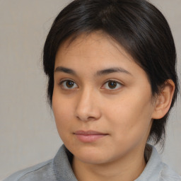 Neutral asian young-adult female with medium  brown hair and brown eyes