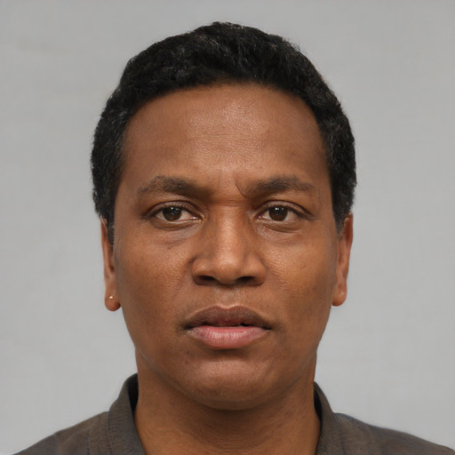 Neutral black young-adult male with short  black hair and brown eyes