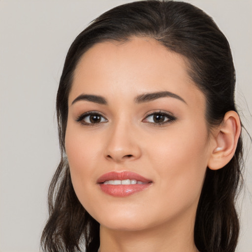 Joyful white young-adult female with long  brown hair and brown eyes