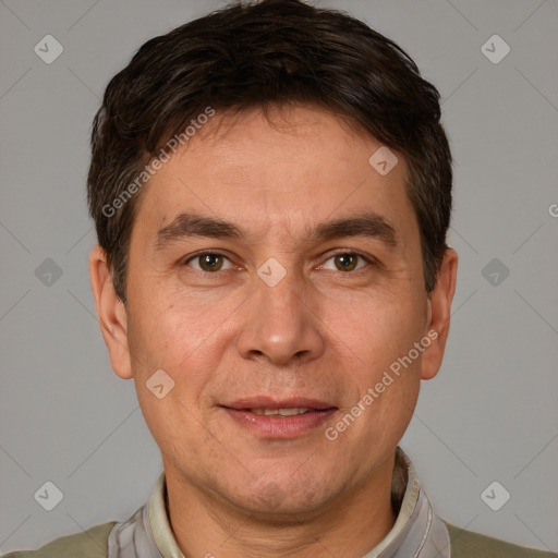 Joyful white adult male with short  brown hair and brown eyes