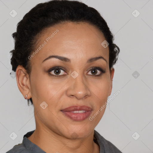 Joyful black adult female with short  brown hair and brown eyes