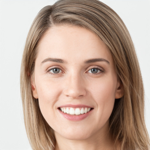 Joyful white young-adult female with long  brown hair and grey eyes