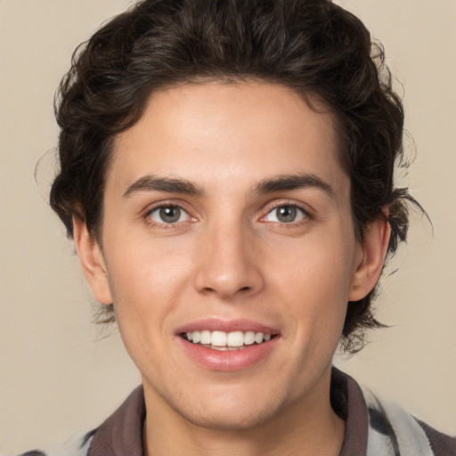 Joyful white young-adult male with medium  brown hair and brown eyes