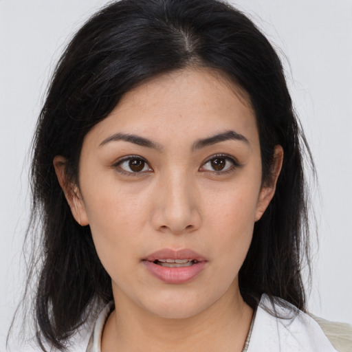 Neutral asian young-adult female with medium  brown hair and brown eyes
