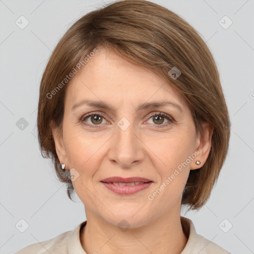 Joyful white adult female with medium  brown hair and grey eyes