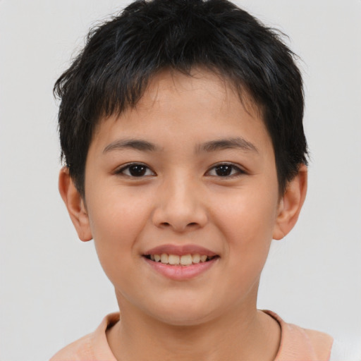Joyful asian child female with short  brown hair and brown eyes