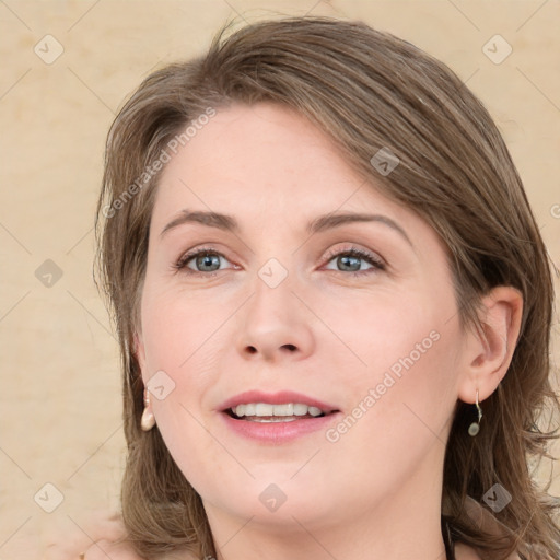 Joyful white young-adult female with long  brown hair and green eyes