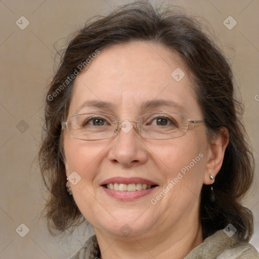 Joyful white adult female with medium  brown hair and blue eyes