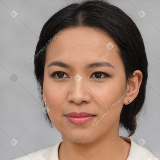 Joyful asian young-adult female with medium  black hair and brown eyes