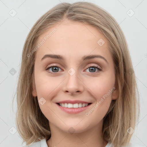 Joyful white young-adult female with medium  brown hair and blue eyes