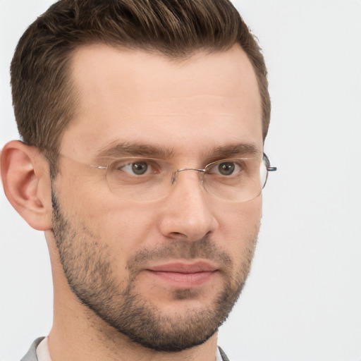 Joyful white adult male with short  brown hair and grey eyes