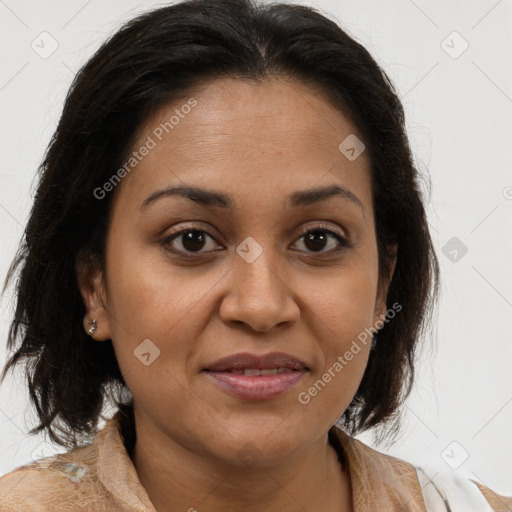 Joyful latino adult female with medium  brown hair and brown eyes