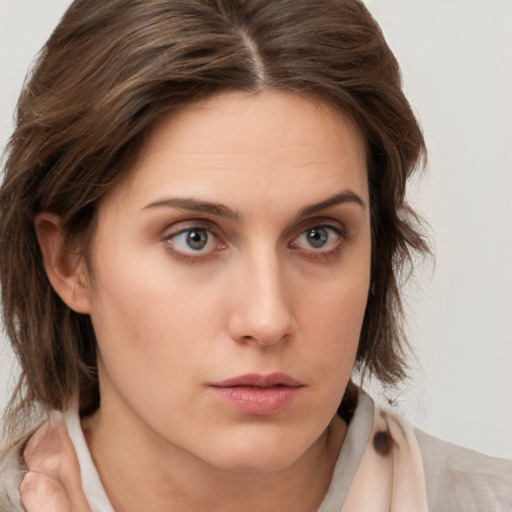 Neutral white young-adult female with medium  brown hair and brown eyes