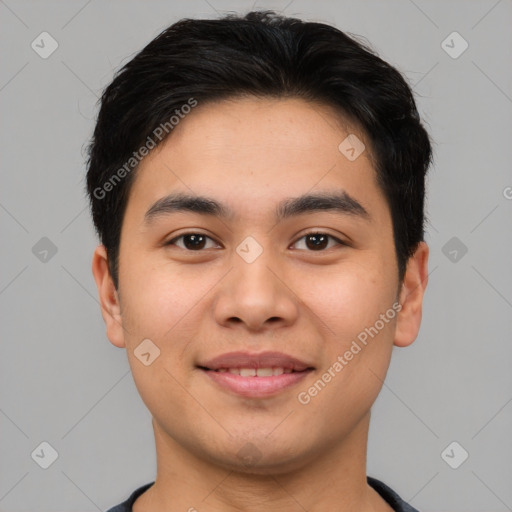 Joyful asian young-adult male with short  black hair and brown eyes