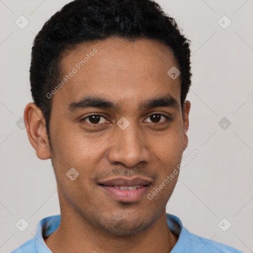 Joyful black young-adult male with short  brown hair and brown eyes