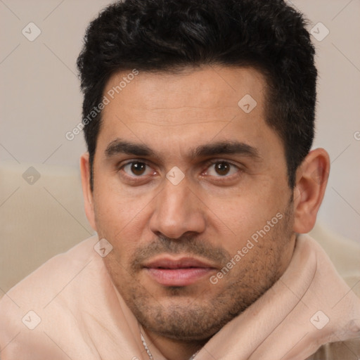 Joyful white young-adult male with short  black hair and brown eyes