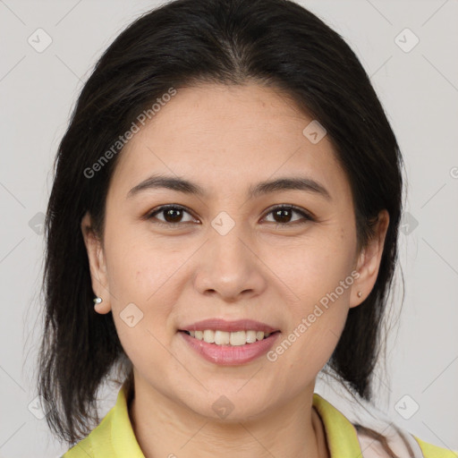 Joyful latino young-adult female with medium  brown hair and brown eyes