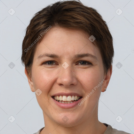 Joyful white young-adult female with short  brown hair and grey eyes