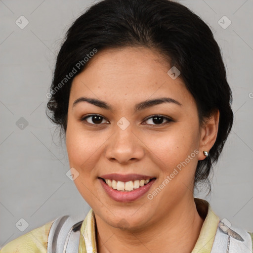 Joyful latino young-adult female with medium  brown hair and brown eyes