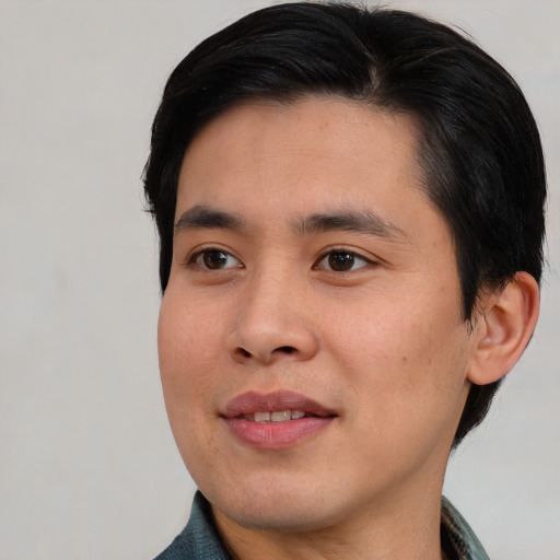 Joyful white young-adult male with short  black hair and brown eyes