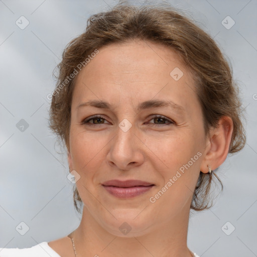 Joyful white adult female with medium  brown hair and brown eyes