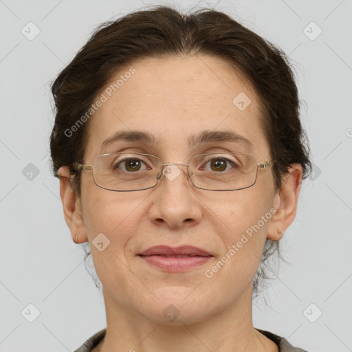 Joyful white adult female with short  brown hair and grey eyes