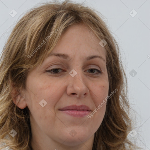 Joyful white adult female with long  brown hair and brown eyes