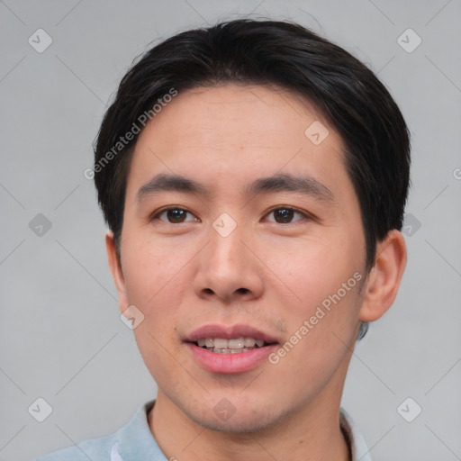 Joyful asian young-adult male with short  brown hair and brown eyes