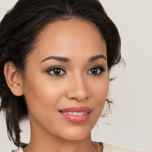 Joyful latino young-adult female with medium  brown hair and brown eyes