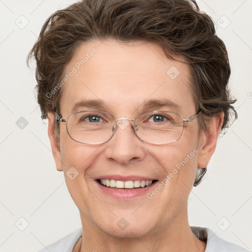 Joyful white adult male with short  brown hair and grey eyes