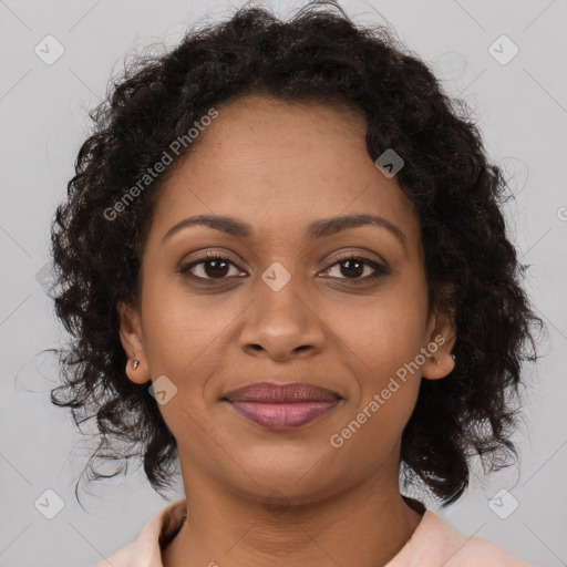 Joyful black young-adult female with medium  brown hair and brown eyes