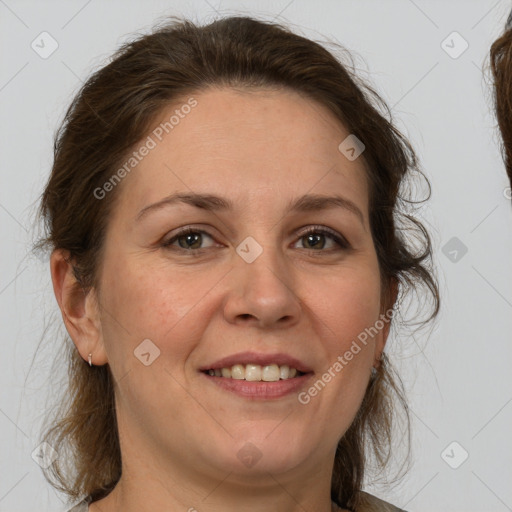 Joyful white adult female with medium  brown hair and grey eyes