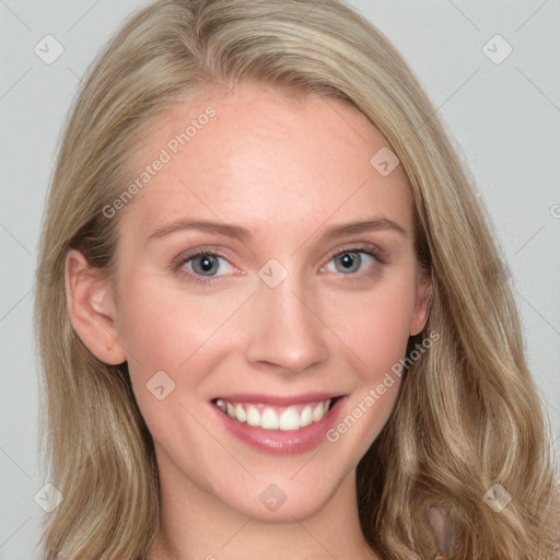 Joyful white young-adult female with long  brown hair and blue eyes