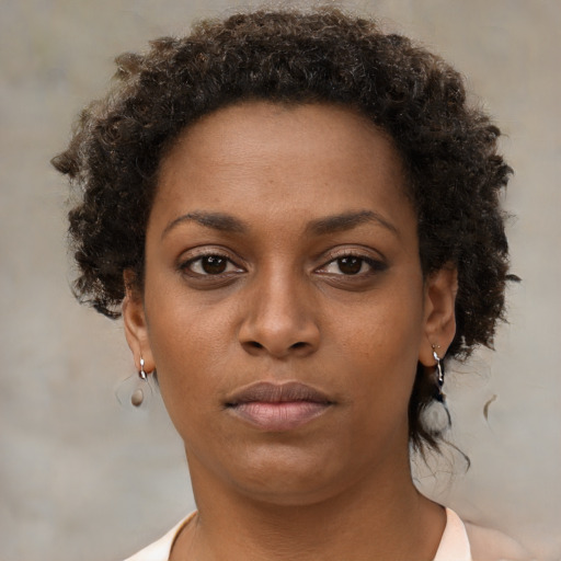 Neutral black young-adult female with short  brown hair and brown eyes